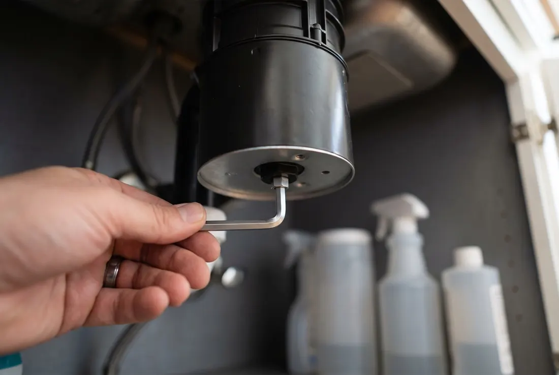The hex socket, dead center on the bottom