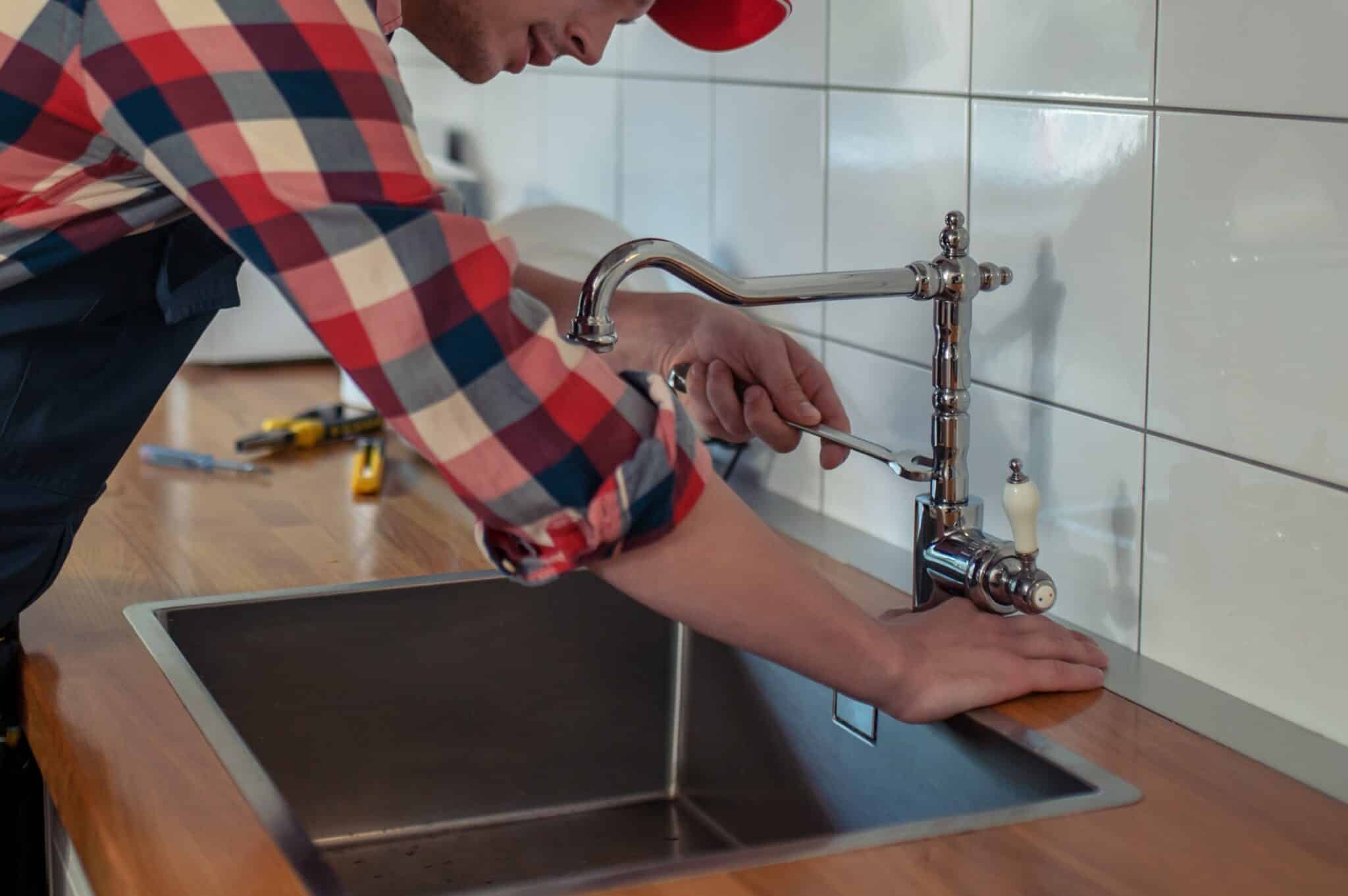 Fixing faucet, California Water Efficiency Standards.